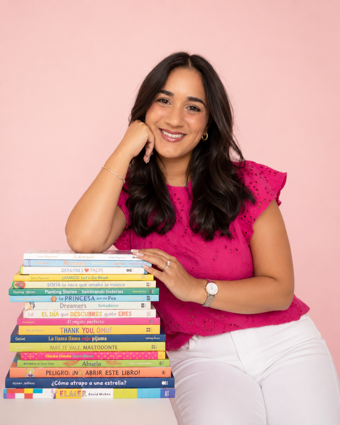 Teacher holding two bilingual children's books